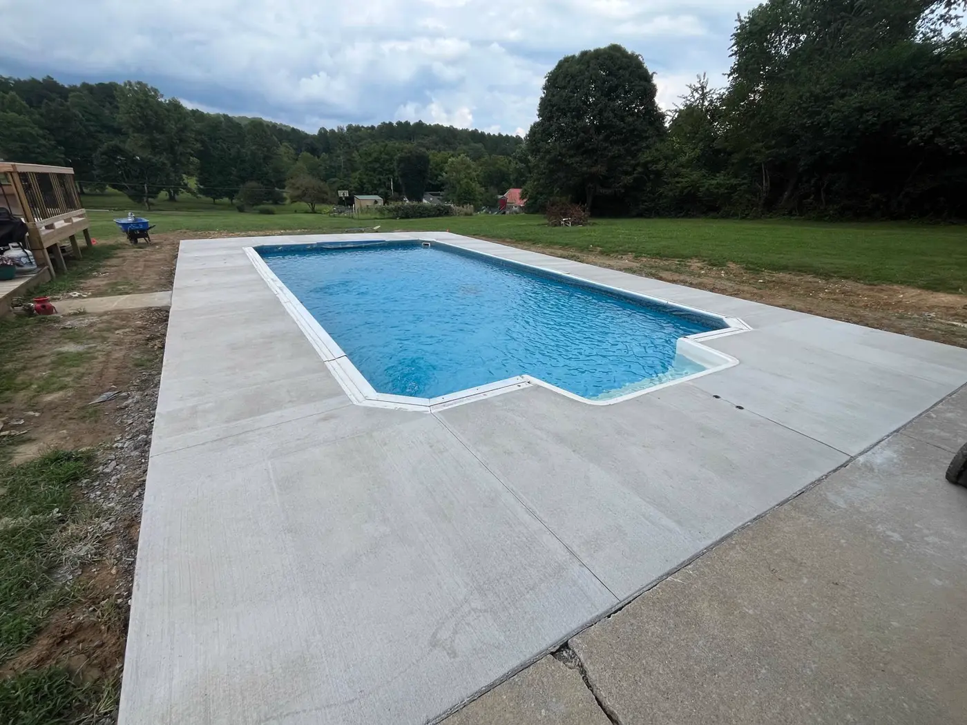 Concrete pool deck poured around an in-ground pool